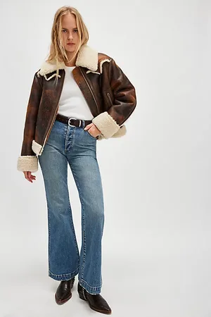 Rollas Jeans Flare East Coast de en , pour femme taille: 27 chez Free People