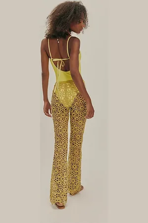 Norma Kamali Lace Boot Pants par en , pour femme chez Free People