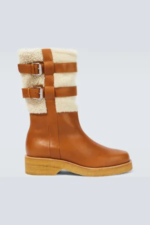 Christian Louboutin Bottes en cuir et shearling