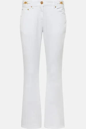 VERSACE Jean flare à taille basse et ornements