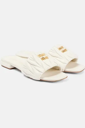 Miu Miu Mules en cuir matelassé à logo