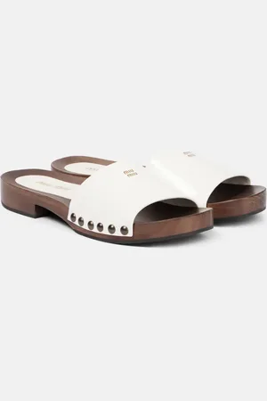 Miu Miu Mules en cuir verni