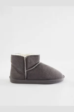 Next Chaussons chaussons en daim doublés de fausse fourrure