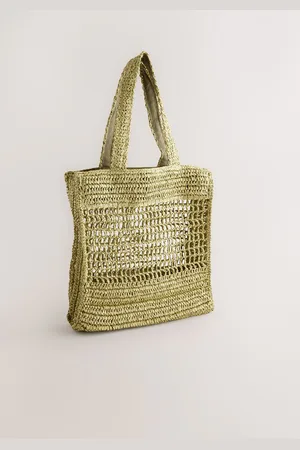 Next Sac à bandoulière en pailleUn an