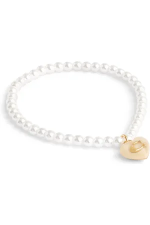 Coach Tone Signature Caur Charm Pearl BraceletUn an