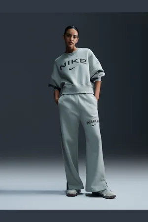 Nike Pantalon de jogging Phoenix Fleece Varsity à jambe large et à taille haute avec logo44-46
