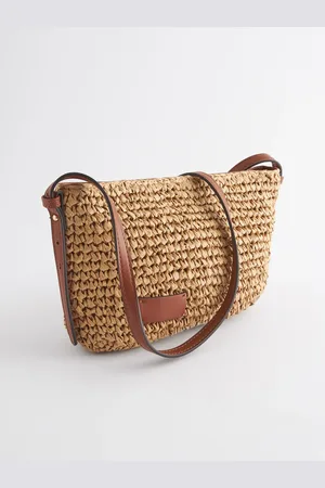 Next Sac à bandoulière en pailleUn an