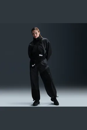 Nike Pantalon tissé ample à taille mi-haute et ourlet ouvert Sportswear pour femme