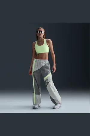 Nike Pantalon tissé ample à taille mi-haute et ourlet ouvert Sportswear pour femme