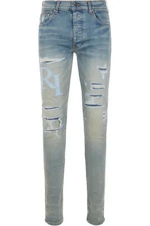 AMIRI Jean skinny aspect déchiré