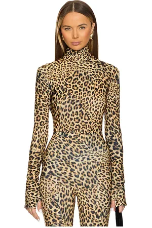 Norma Kamali Slim Fit Long Sleeve Turtleneck Top in .