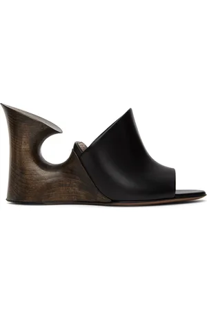 Alaïa Mules sculpturales noires