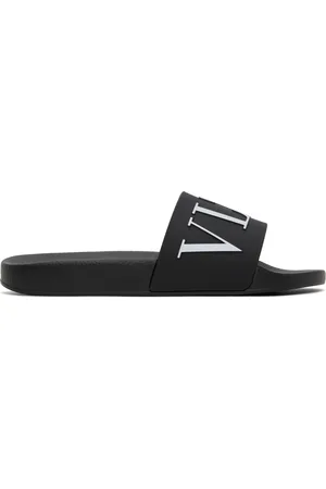 VALENTINO GARAVANI Sandales à enfiler noires à logo VLTN