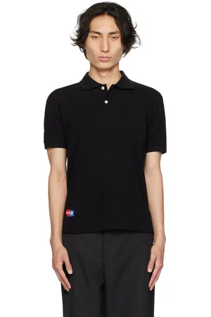 Comme des Garçons Polo noir édition Invader