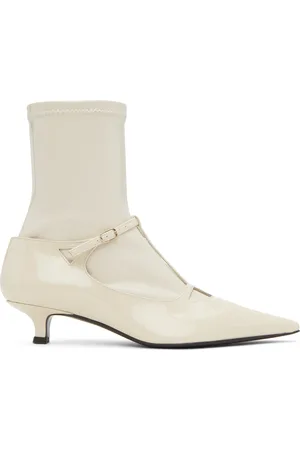 The Row Bottes Cyd blanc cassé en cuir verni