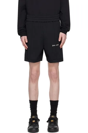 Palm Angels Short de survêtement noir à rayures