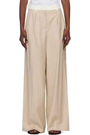 REMAIN Birger Christensen Pantalon ample beige à taille contrastante