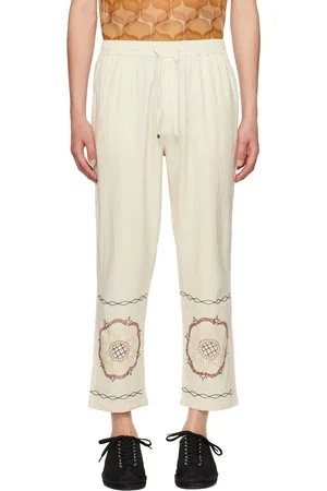 HARAGO Pantalon blanc cassé à motif graphique brodé