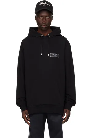 Balmain Pull à capuche noir à écusson Pierre