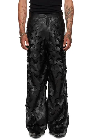LU’U DAN Pantalon noir en cuir synthétique à motif usiné par laser