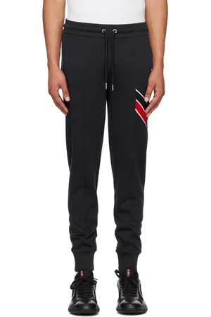 Moncler Pantalon de survêtement bleu marine à garniture à rayures