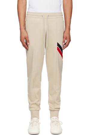 Moncler Pantalon de survêtement gris à garniture à rayures