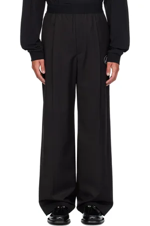 We11 Done Pantalon noir à écusson à logo