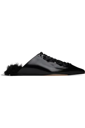 Simone Rocha Chaussures à enfiler noires à bout pointu et à doublure en fourrure synthétique
