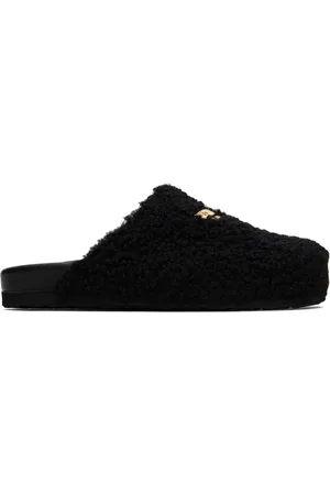 Moschino Pantoufles noires en peau retournée