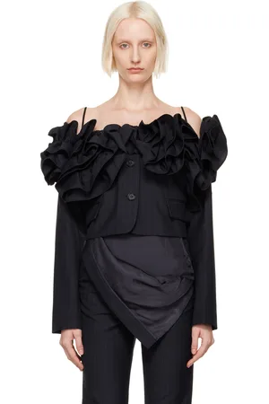 pushBUTTON Blouson bleu marine à volants et à épaules dénudées
