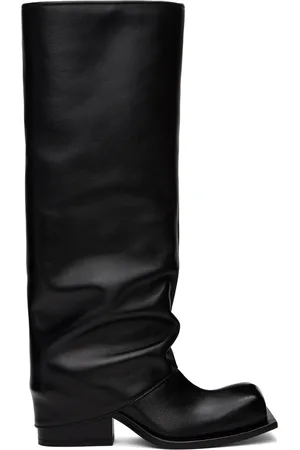 FIDAN NOVRUZOVA Bottes à talon bottier Havva noires à empiècement de style pantalon