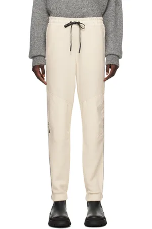Moncler Pantalon de détente blanc cassé à rayures réfléchissantes