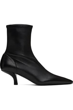 Totême Bottes à petit talon noires à col de style chaussette