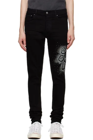 AMIRI Jean skinny noir à monogramme modifié et à ornements facettés