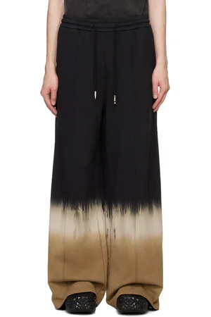 Feng Chen Wang Pantalon de survêtement noir à motif tie-dye