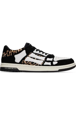 AMIRI Baskets basses noir et beige à appliqués Skel Top et à motif léopard