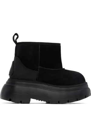R13 Bottes noires à semelle épaisse et à intérieur en peau retournée
