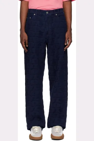 AWAKE NY Jean bleu marine à motif à texte en tissu jacquard