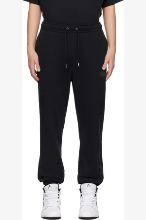 Nike Pantalon de survêtement noir en jersey bouclette à logo