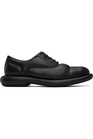 MARTINE ROSE Chaussures oxford noires édition Clarks