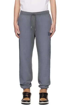Nike Pantalon de survêtement gris en jersey bouclette à logo