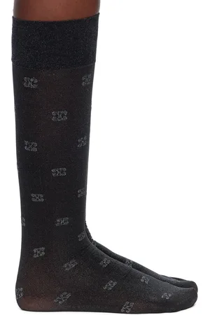 Ganni Chaussettes noires en filet à motif scintillant à logos papillon