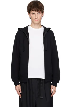 Comme des Garçons Pull à capuche noir à glissière et à écusson à logo rouge