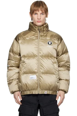 A Bathing Ape Blouson beige rembourré en duvet à glissière et à logos AAPE Now et Moonface