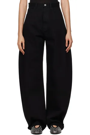 Alaïa Jean noir à coutures extérieures incurvées