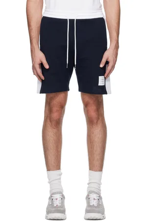 Thom Browne Short de survêtement bleu marine en jersey bouclette à quatre rayures