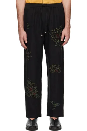 HARAGO Pantalon noir à images de tournesol brodées