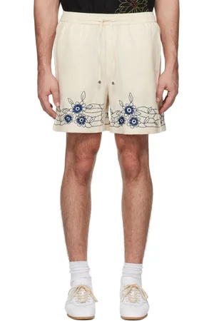 HARAGO Short blanc cassé à motif fleuri brodé