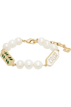 Casablanca Bracelet doré et blanc à perles et à breloque à feuilles de laurier
