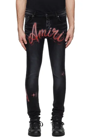 AMIRI Jean skinny noir à logos à effet aérosol